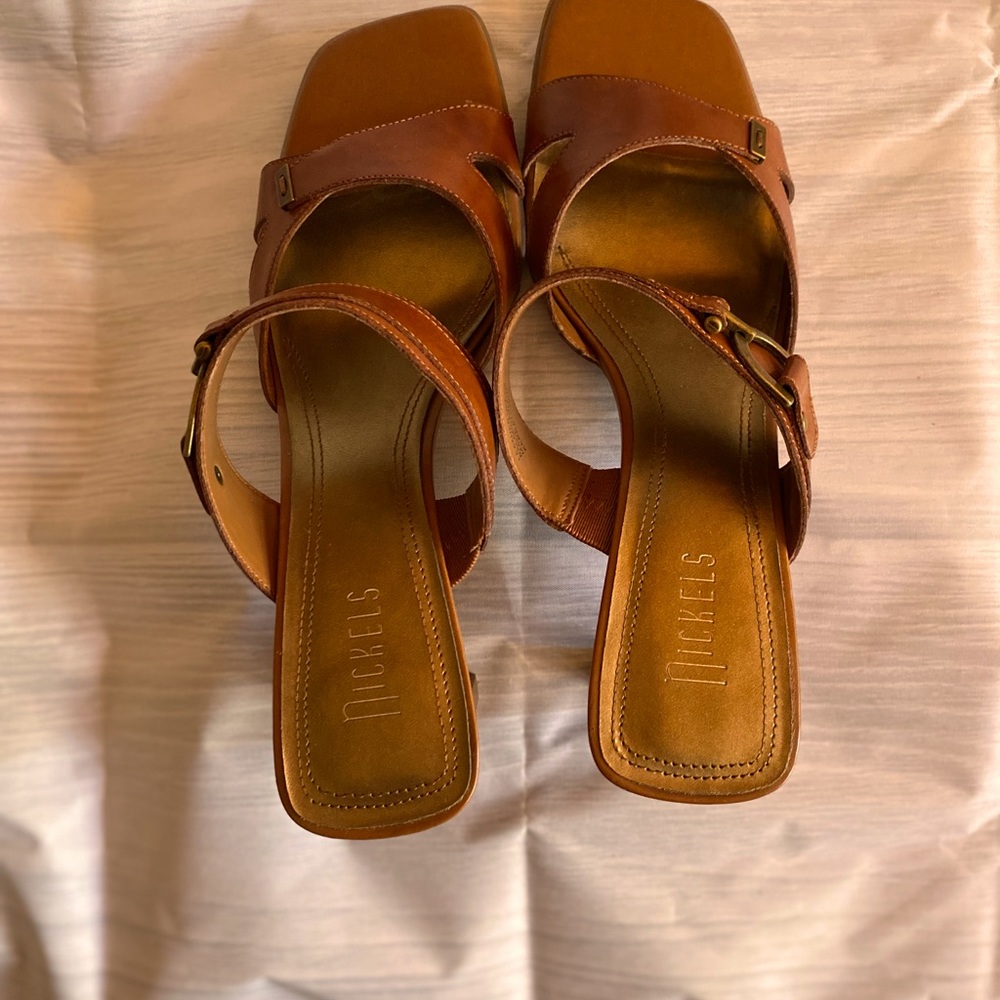 Beautiful sandal comfortable, never worn perfect for dress up or dress down.